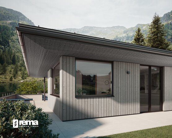 Modernes Wohnhaus mit vertikaler Holzfassade aus dem REMA-System vor Berglandschaft | © Daniel Sobietzki